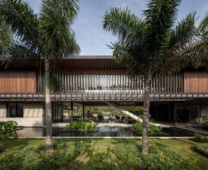 Modern house exterior with wooden accents and concrete elements.