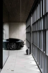 A modern garage with metal and glass features.