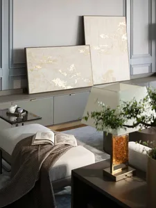 Modern living room featuring neutral-toned abstract wall art and a minimalist design aesthetic.