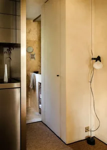 A minimalist bathroom showcasing organic tile surfaces