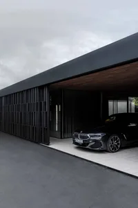A modern building exterior featuring a combination of concrete and glass materials.