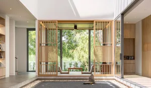 A modern living room featuring proper window placement for optimal natural light and views.
