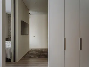 Modern minimalist interior design with neutral tones and sleek lines.