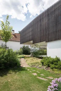 A modern house exterior featuring wooden panels