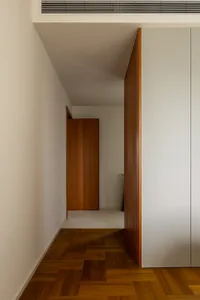 Modern minimalist interior design featuring wooden materials.