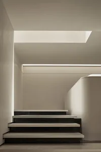 Modern minimalist stairs made of concrete and marble materials.
