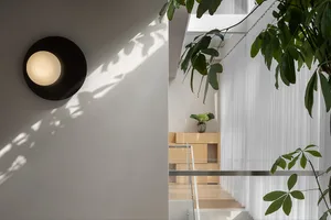 Modern residential interior featuring glass and steel materials.