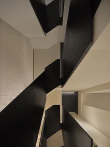 Modern black metal staircase design viewed from above.