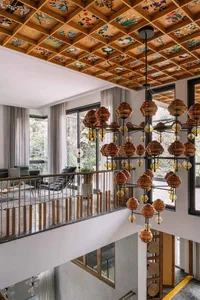Modern interior room featuring glass hanging lights and large windows