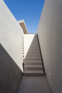 Minimalist concrete stairs with light and shadows