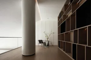 Modern minimalist living space with wooden, glass, and concrete elements.