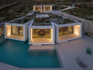 Modern residential architecture featuring concrete with a rooftop garden and a pool.