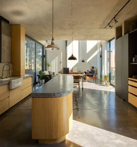 Modern industrial kitchen with concrete countertops and pendant lights