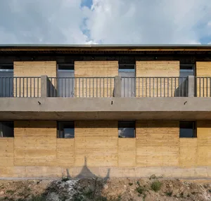 Concrete building with modern architectural features and a flat roof.