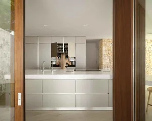 Innovative minimalist kitchen with sleek metallic cabinetry and integrated appliances.