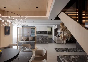 Modern residential kitchen featuring marble countertops and walls, with a contemporary design and minimalist aesthetics.