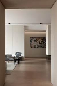 A minimalist desk in a modern interior design setting.