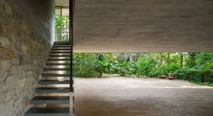 A modern interior space featuring stone and concrete materials.