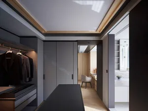 A modern closet with gray paneled walls, dark wood floors, and a minimalist design.