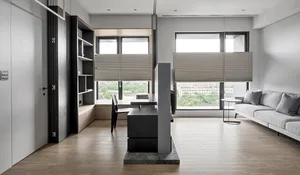 A minimalist living room featuring modern design elements such as wood, marble, and glass.