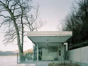 A minimalist residential retreat featuring glass and wood elements.