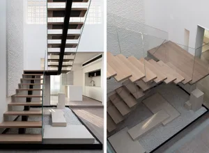 Modern minimalist staircase with metal railings and wooden steps.
