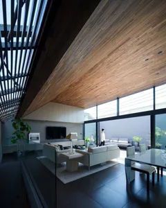 A modern living room featuring wood elements and a spacious layout.