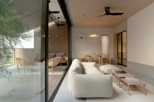 Modern minimalist living room featuring contemporary furniture and neutral color palette