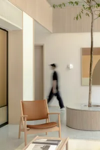 A modern lobby with terrazzo flooring and a minimalist design.
