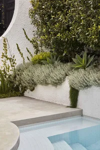 Modern minimalist outdoor retreat featuring concrete and tile surfaces.