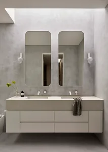 Modern minimalist bathroom with concrete walls, white floor, and a double vanity with a white countertop.