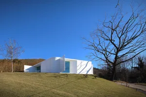 Modern house with glass windows and white exterior