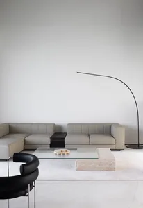 A modern minimalist living room with neutral tones and a sleek, contemporary design.