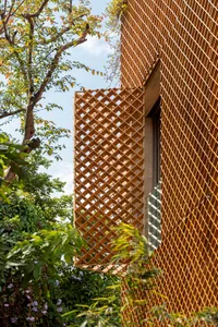 Modern building exterior featuring a wooden lattice design.