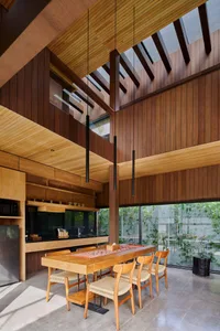 Modern industrial dining room with a wooden table and chairs