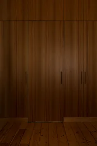 A modern interior design featuring dark wood cabinets.