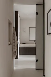 Modern bathroom with concrete surfaces and minimalist design.