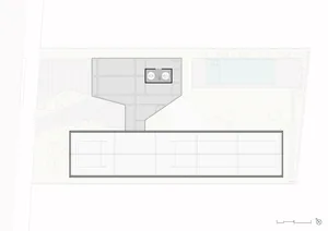 A modern floor plan featuring a concrete structure with a rectangular layout and a central open space.