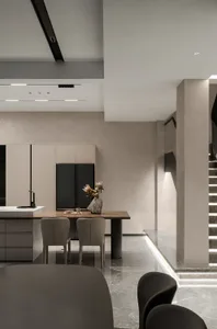 A minimalist residential kitchen featuring marble countertops and flooring.