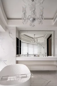 A sleek, modern bathroom designed with pure white marble and minimalist features.