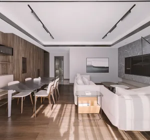 A modern living room with a wooden floor, marble walls, metal light fixtures, and a fabric sofa.