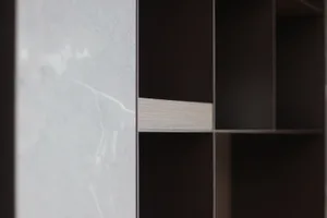A close-up view of an industrial storage unit designed with a combination of marble and concrete materials.