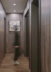 A modern industrial corridor made of wood with a person walking through it
