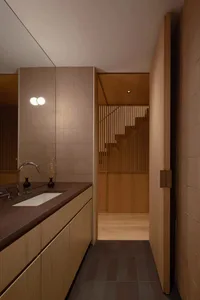 Modern minimalist bathroom with wooden and concrete accents