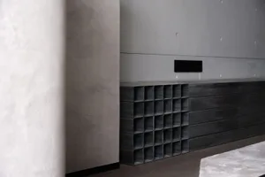 Minimalist design featuring metal panels in a modern interior setting.
