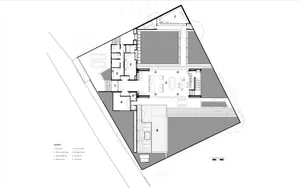 Floor plan of a modern house showcasing a ground floor with a spacious living area, kitchen, and outdoor space.