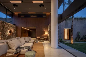 A modern residential space featuring concrete walls and a minimalist design.