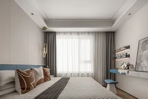 A minimalist bedroom with fabric bedding, wooden headboard, and metallic accents.