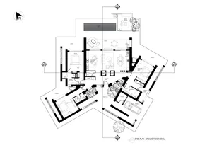 Floor plan of a modern residential layout featuring concrete and glass materials.
