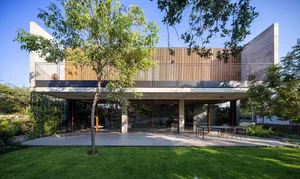 A modern private residence featuring concrete and wood materials